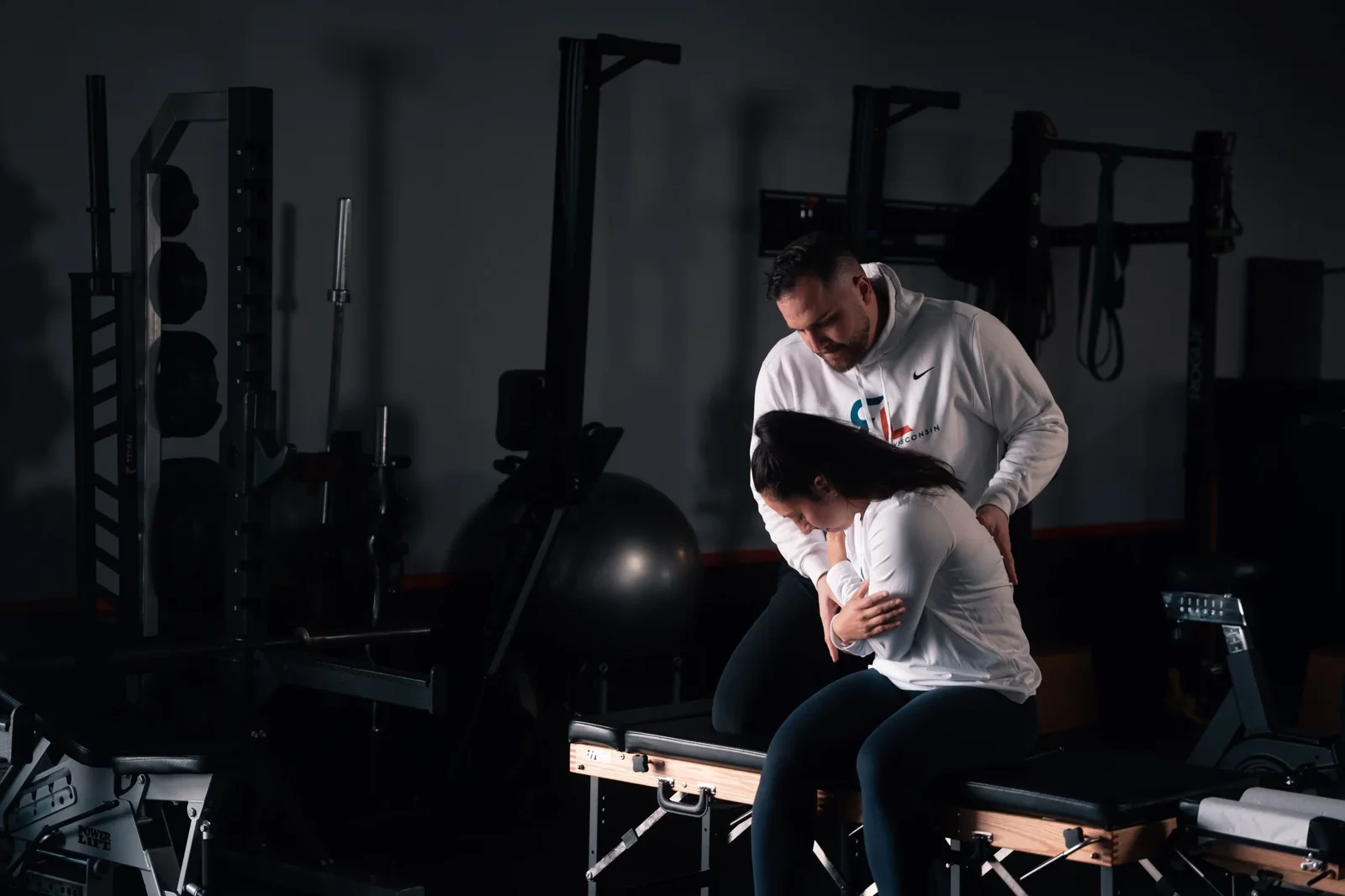 Dr. Sam Wagner coaching a patient through low back rehab at Rehab Lab